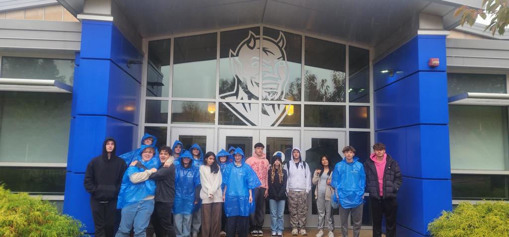 students by blue devils logo