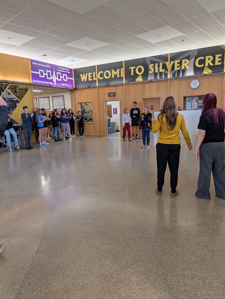 Leah in lobby with students
