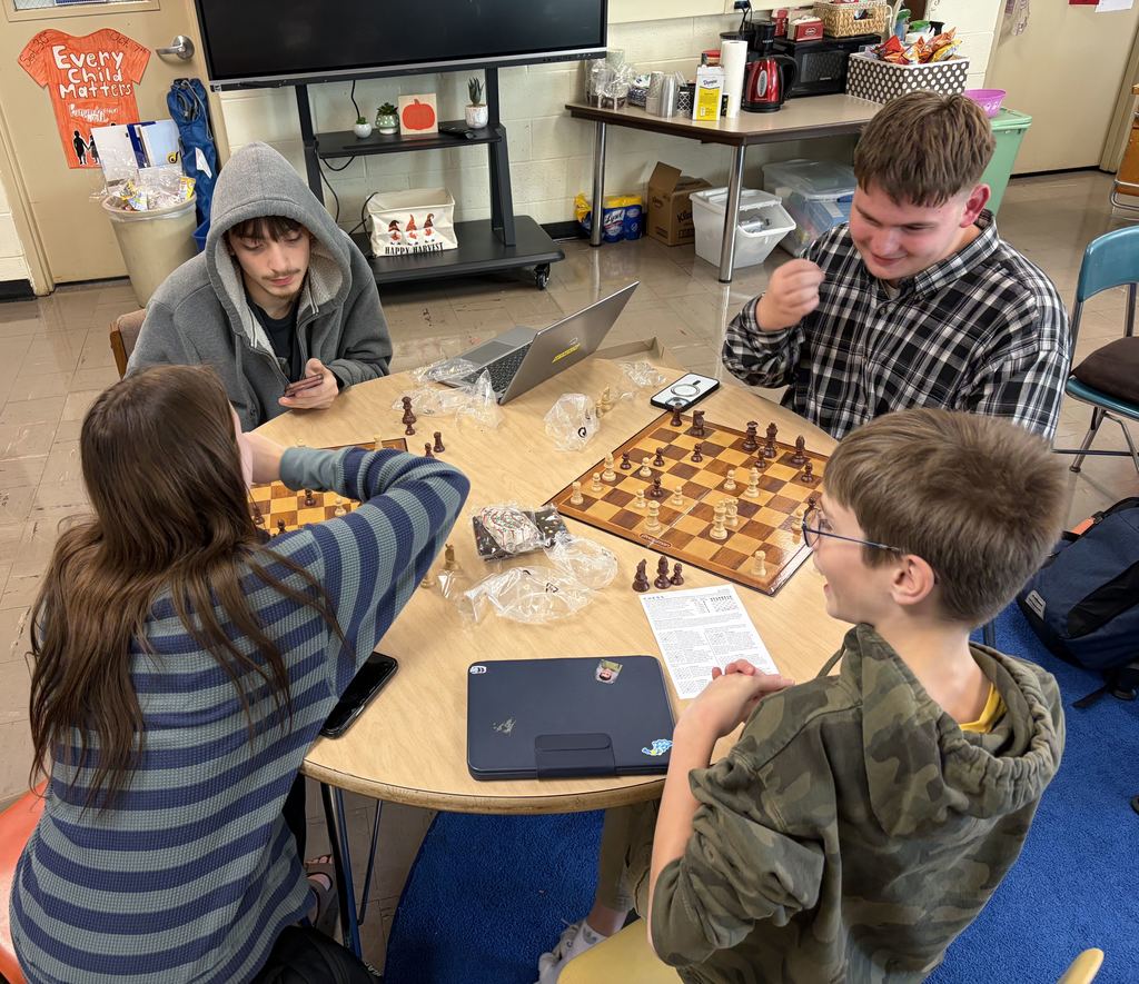 Chess club 4 students playing games