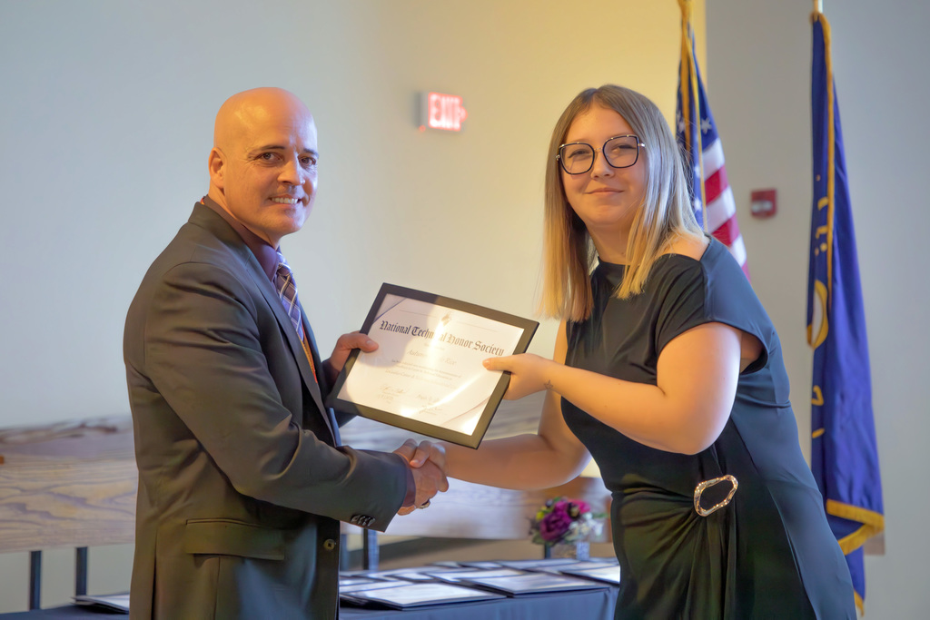 Autumn Rice receiving certificate