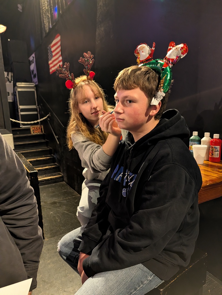 boy getting face painted