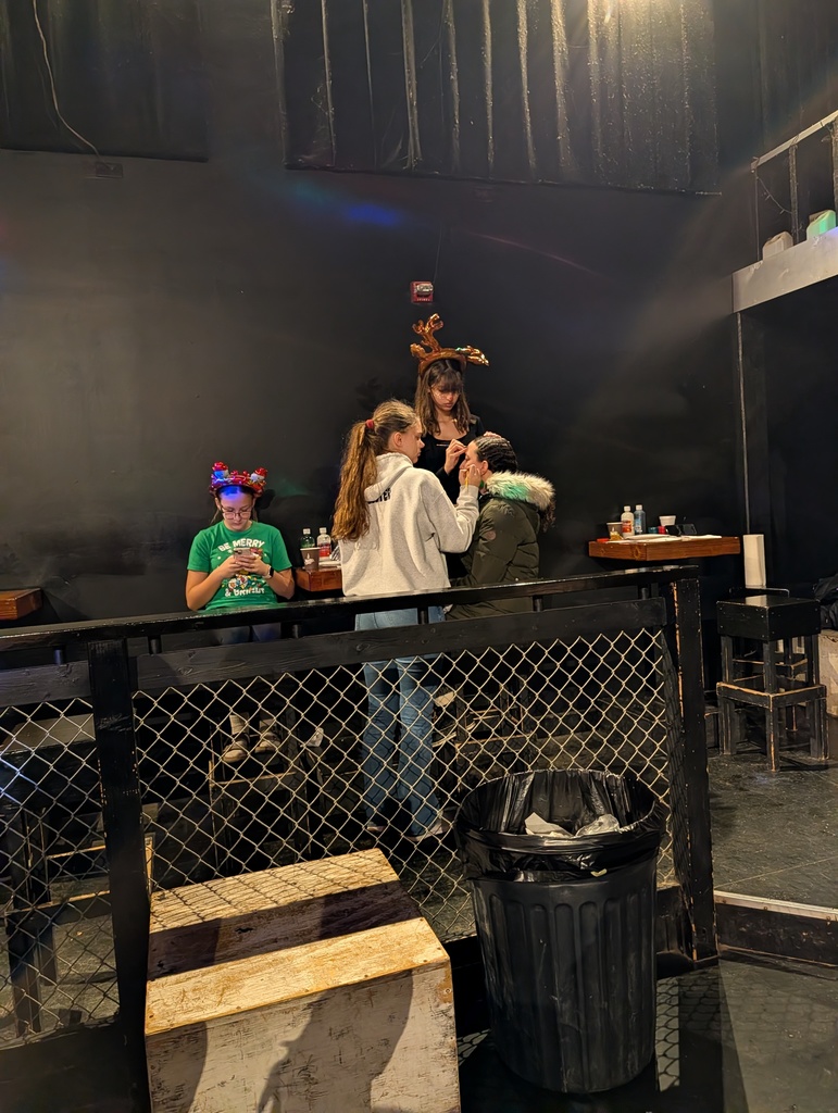 student volunteers doing face painting