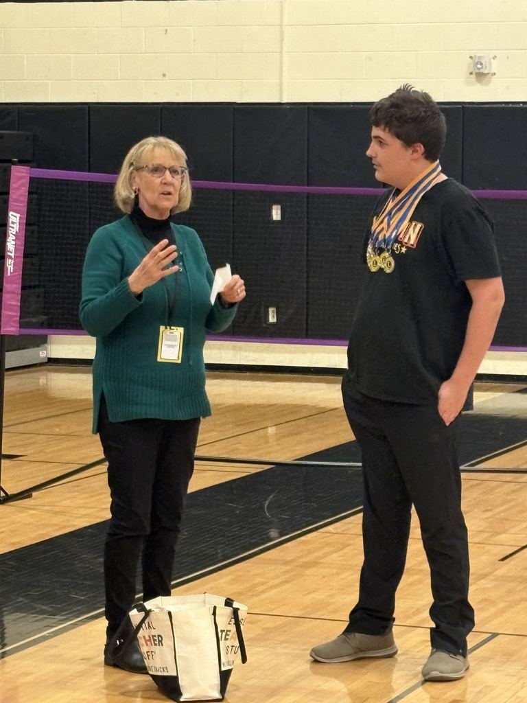 Joe listening to Mrs. Oyer speak