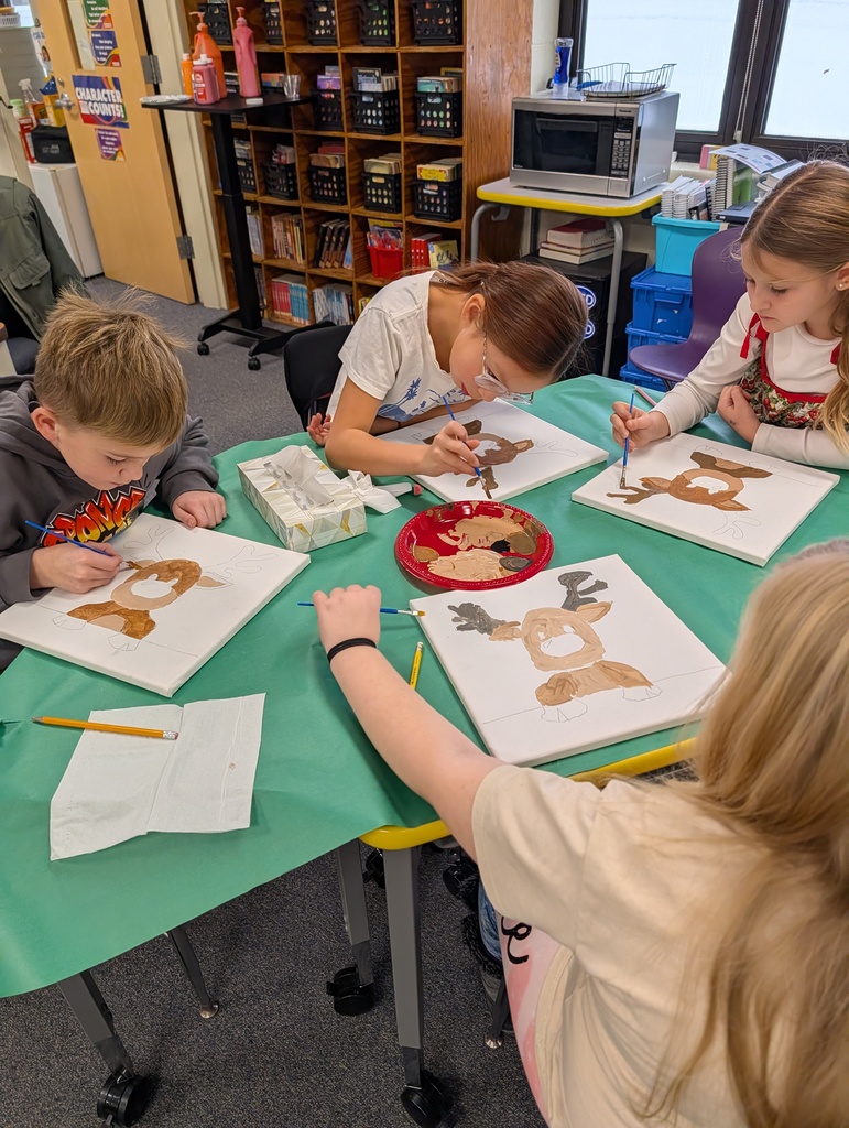 students at tablepainting reindeer