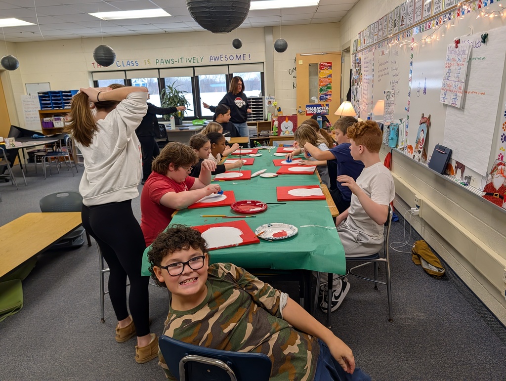 students at table painting snowmen