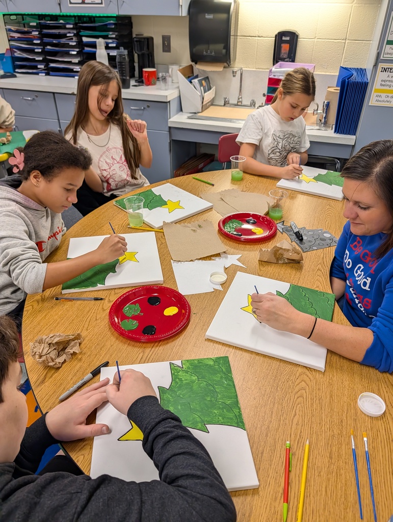students painting trees