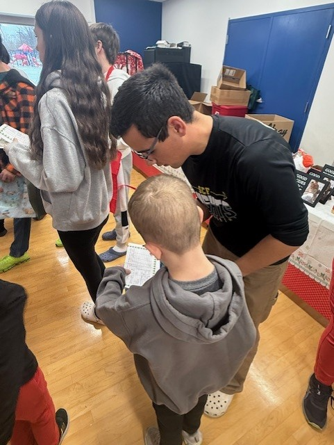 boys looking at shopping list