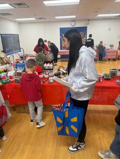 student holding shopping bag
