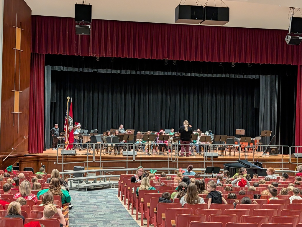 Ms. Bachowski directing band on stage