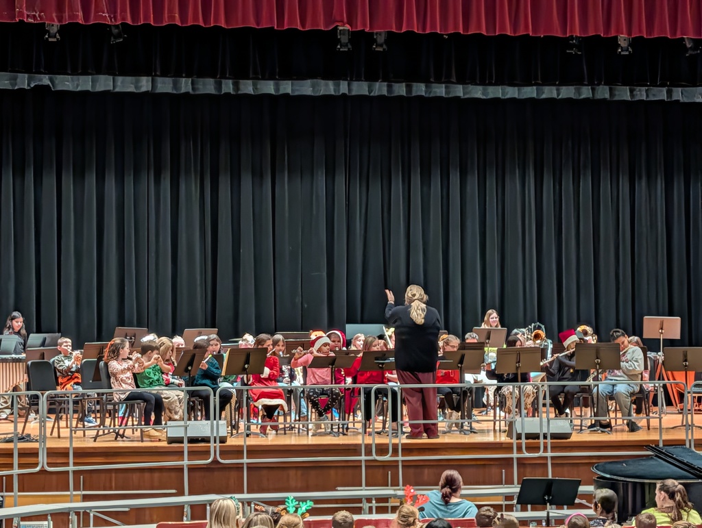 Ms. Bachowski directing band on stage