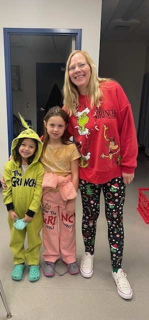 Staff and students in Grinch outfits