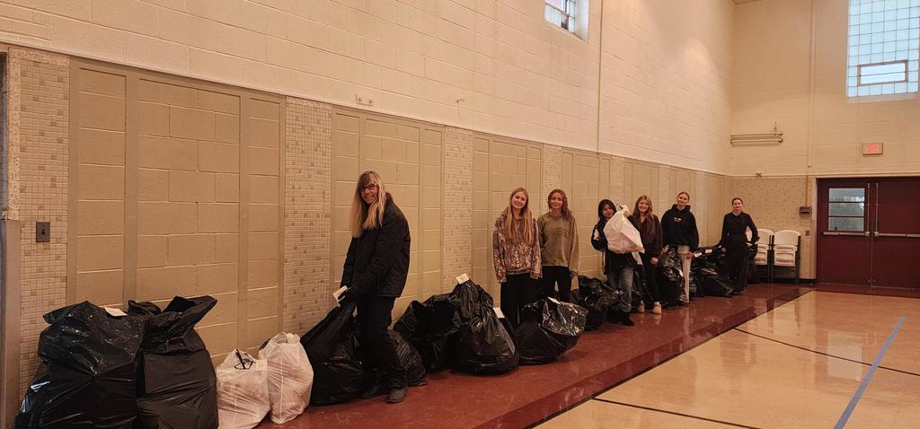 Key CLub students holding bags of toys