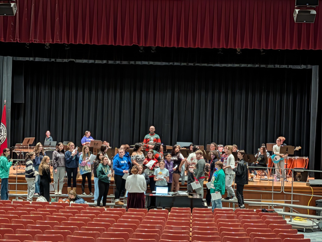 HS Band and Chorus practicing in auditorium