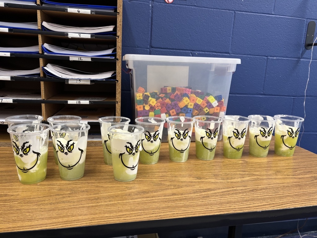 Green milkshake in grinch cups