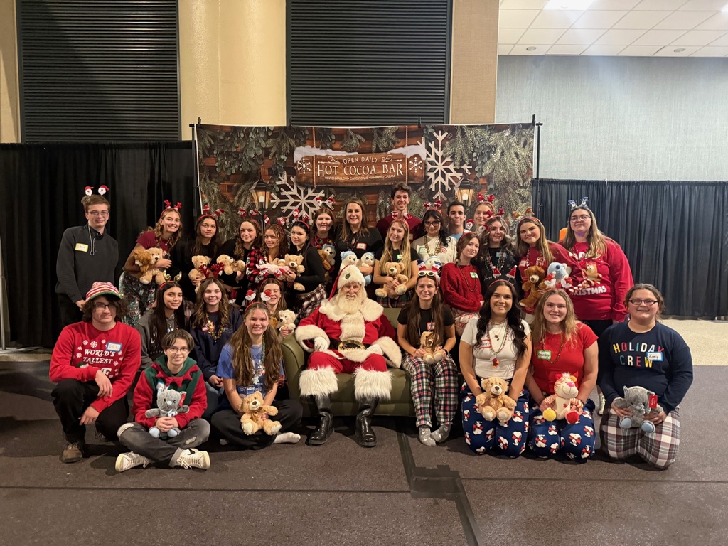 The whole group poses with Santa. 