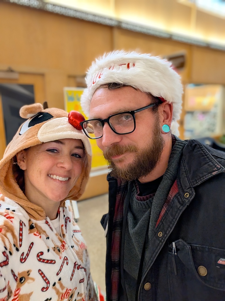 Employees dressed as Santa and Rudolph