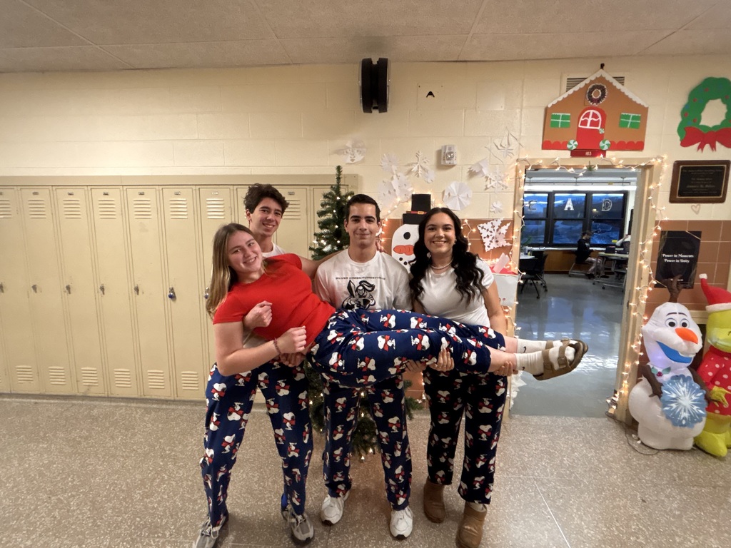 4 students in matching holiday pajama pants