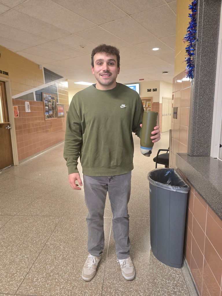 Mr. Shuart in green and gray with a matching water bottle