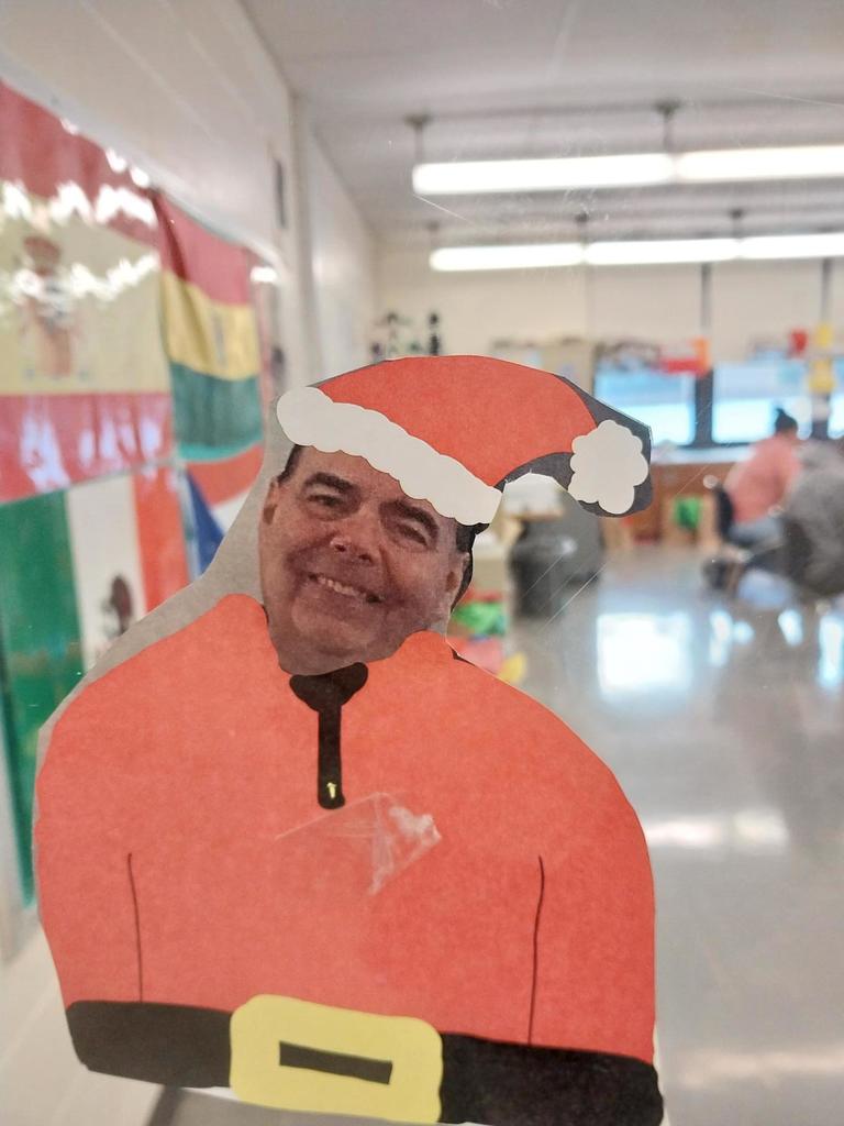 Mr. VanDette's face in a Santa paper cutout