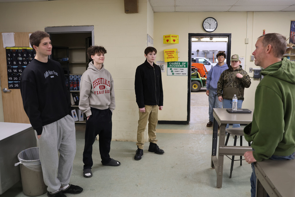 students speak with a teacher