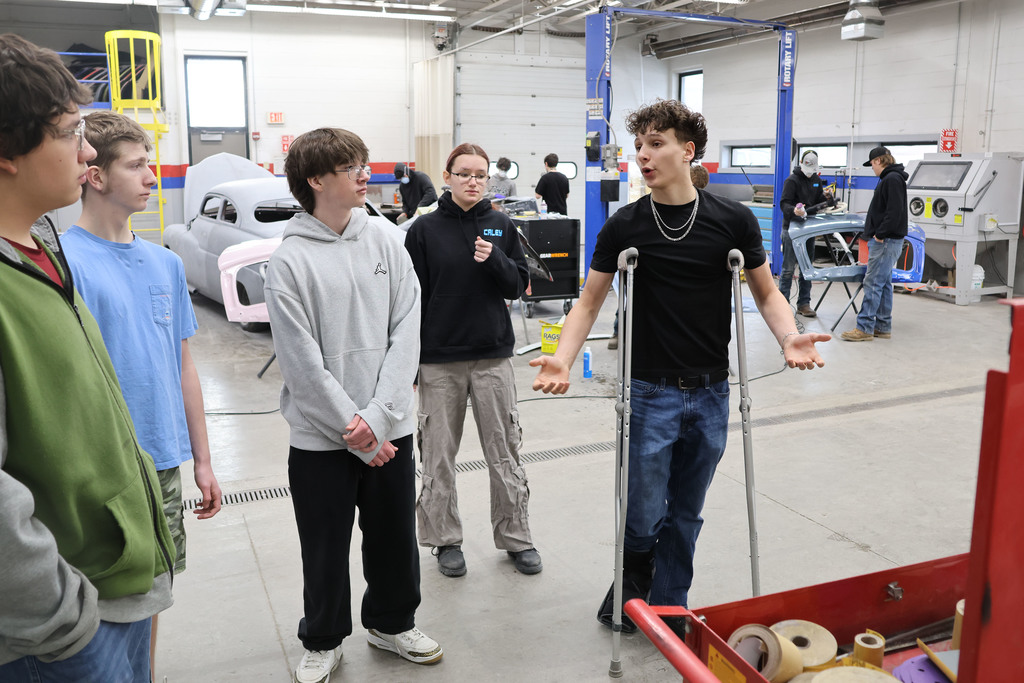 students learn about auto body in the shop. 