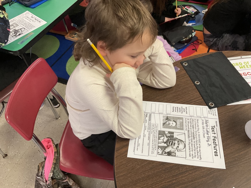 A student reads a worksheet on Martin Luther King. 
