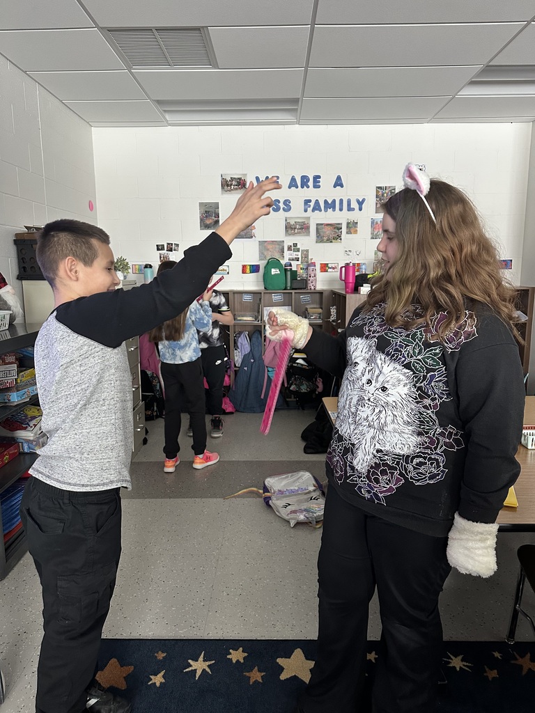 boy and girl watching ruler drop