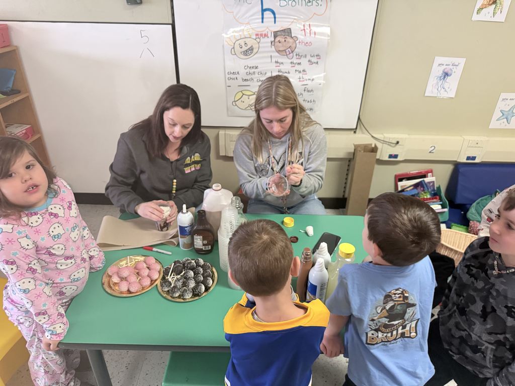 students at table with snacks