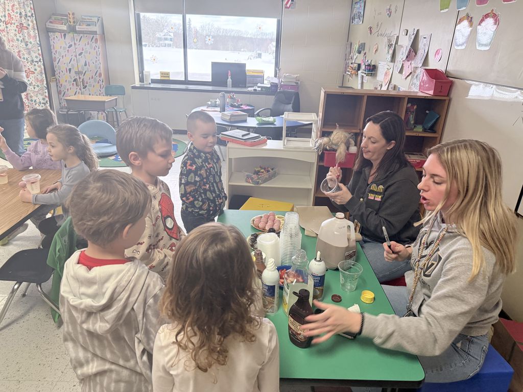 students at table with snacks