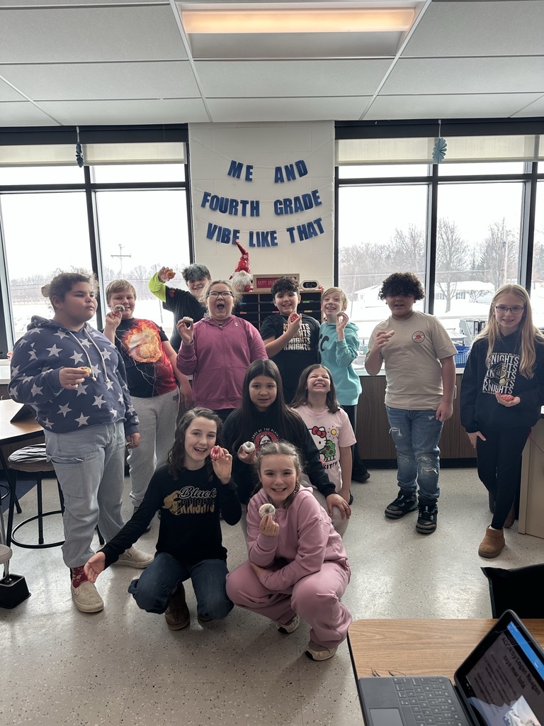 4th graders in classroom with donuts