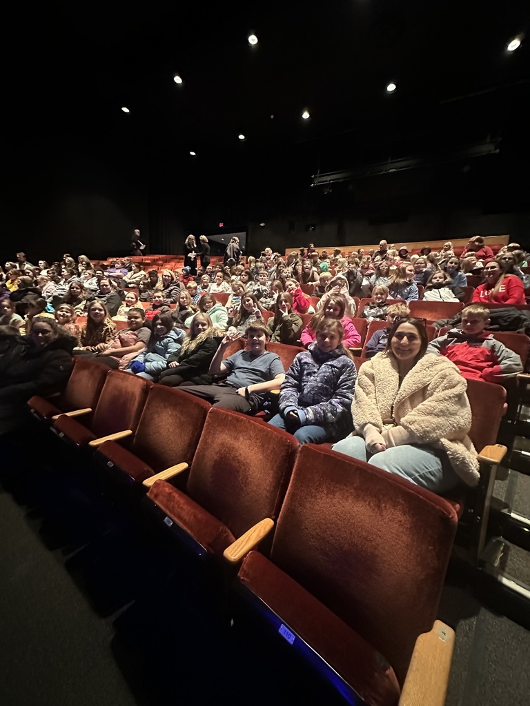 students seated in large theater