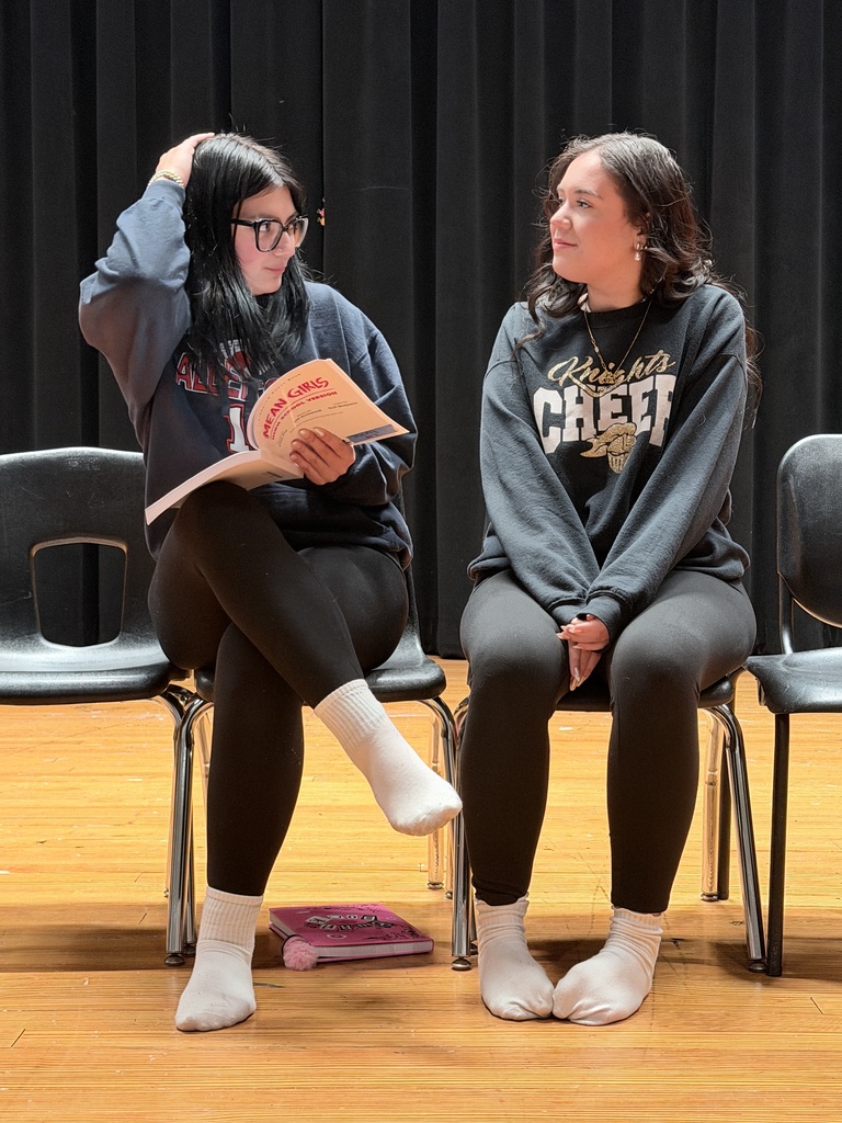 two students read their lines.
