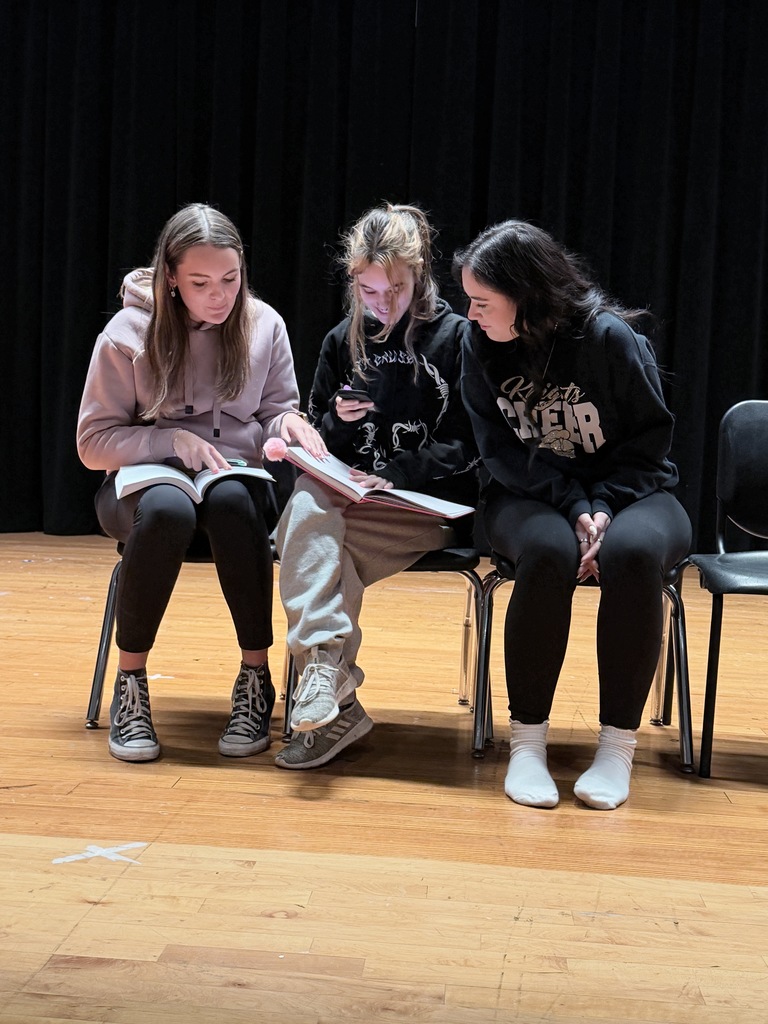 Three students read their scripts.