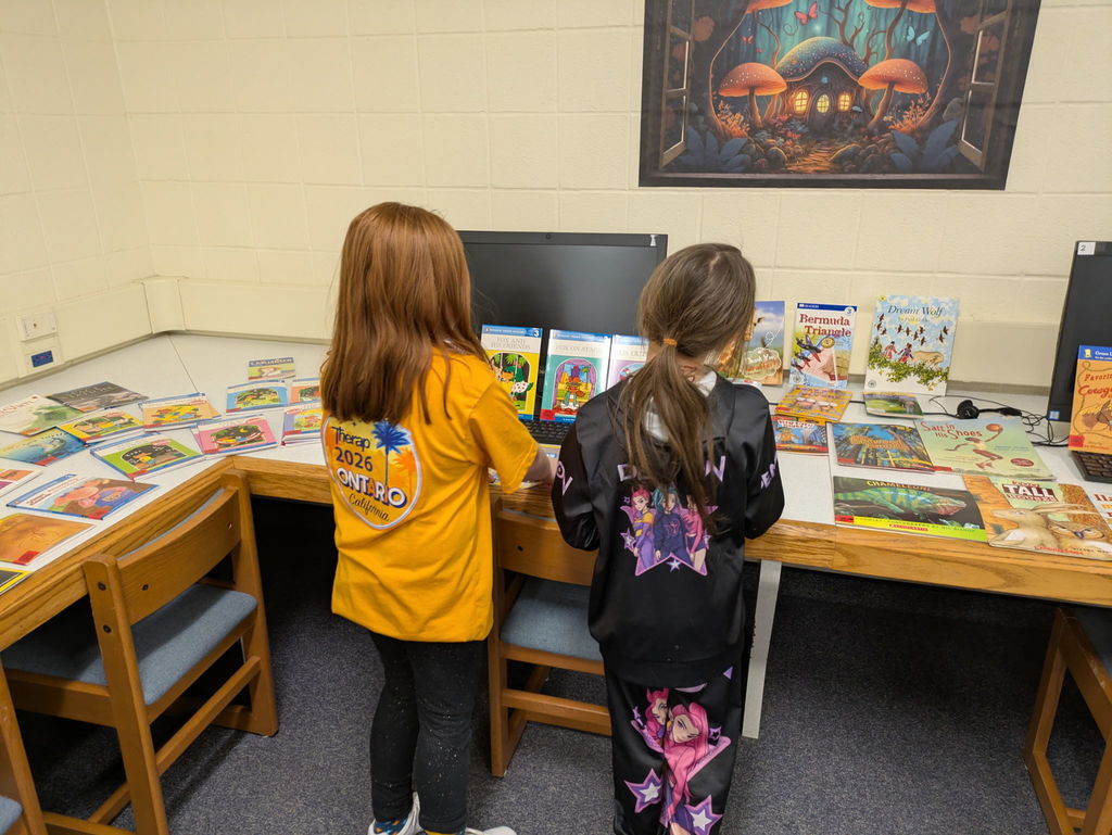 Students browsing books in the library