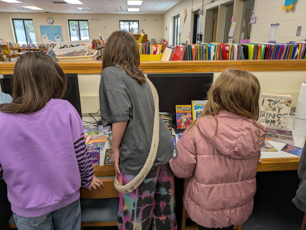 Students browsing books in the library