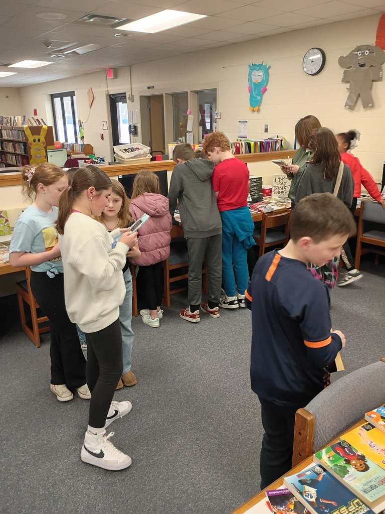 students sharing book sleections with each other