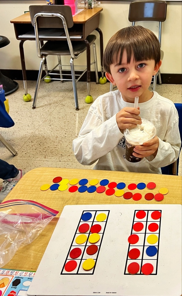 a student holds a drink