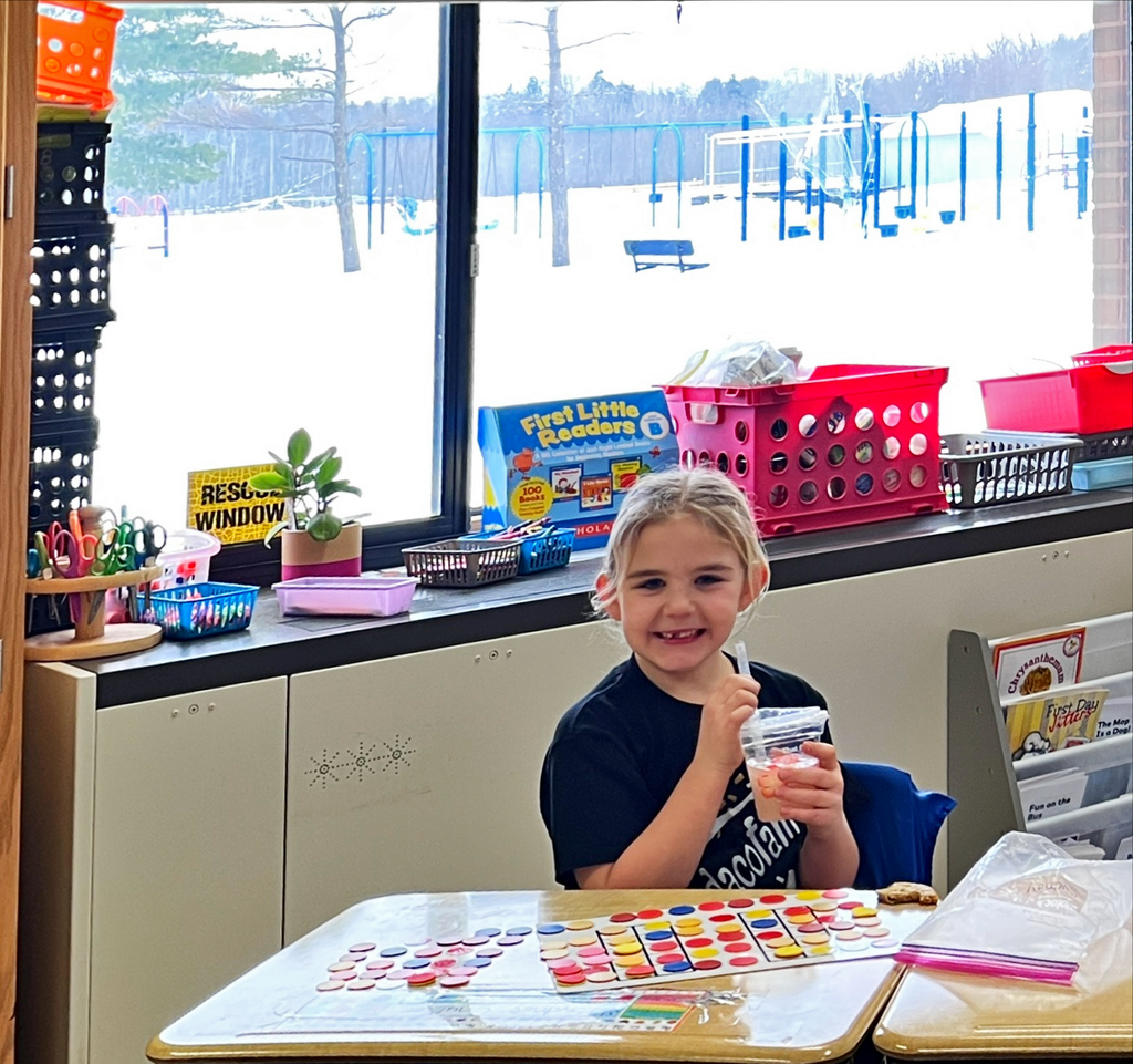 a student holds a drink