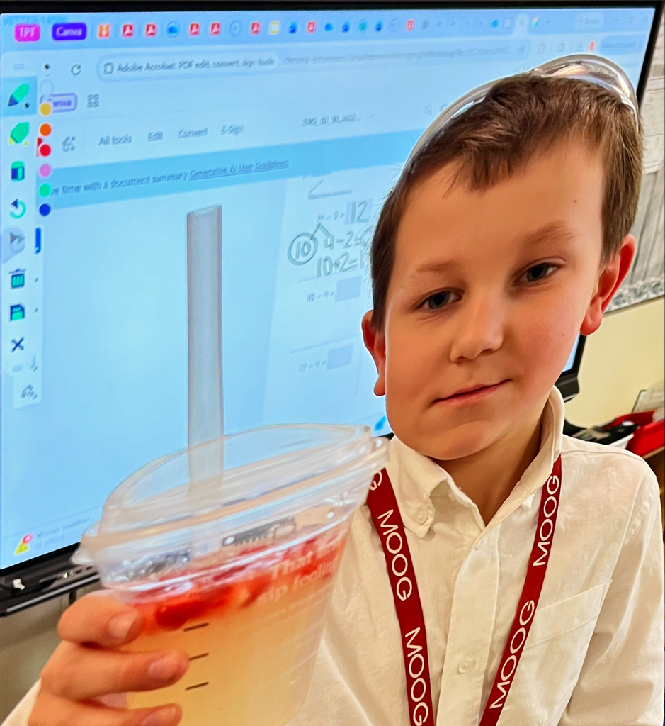 a student holds a drink