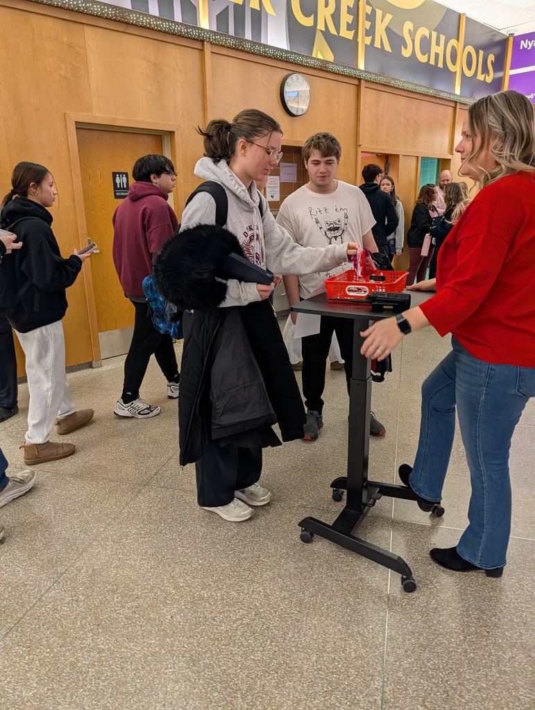 students pick prizes from the game bin