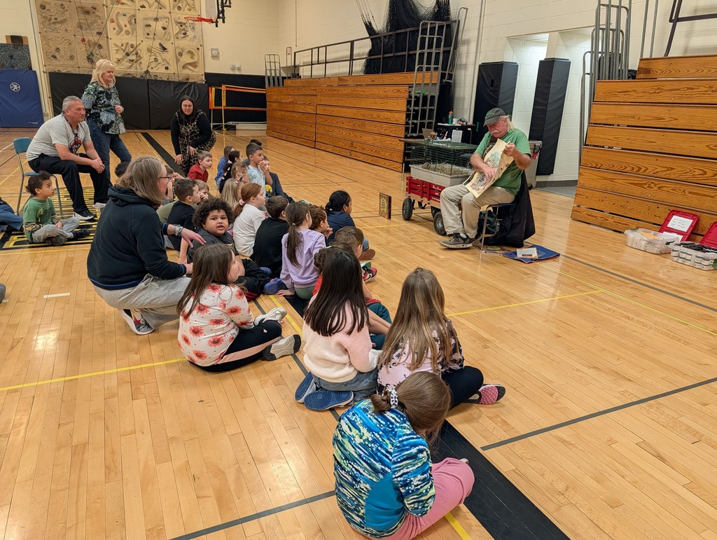students watch as Mr. Morton shows a fact sheet about prairie dogs
