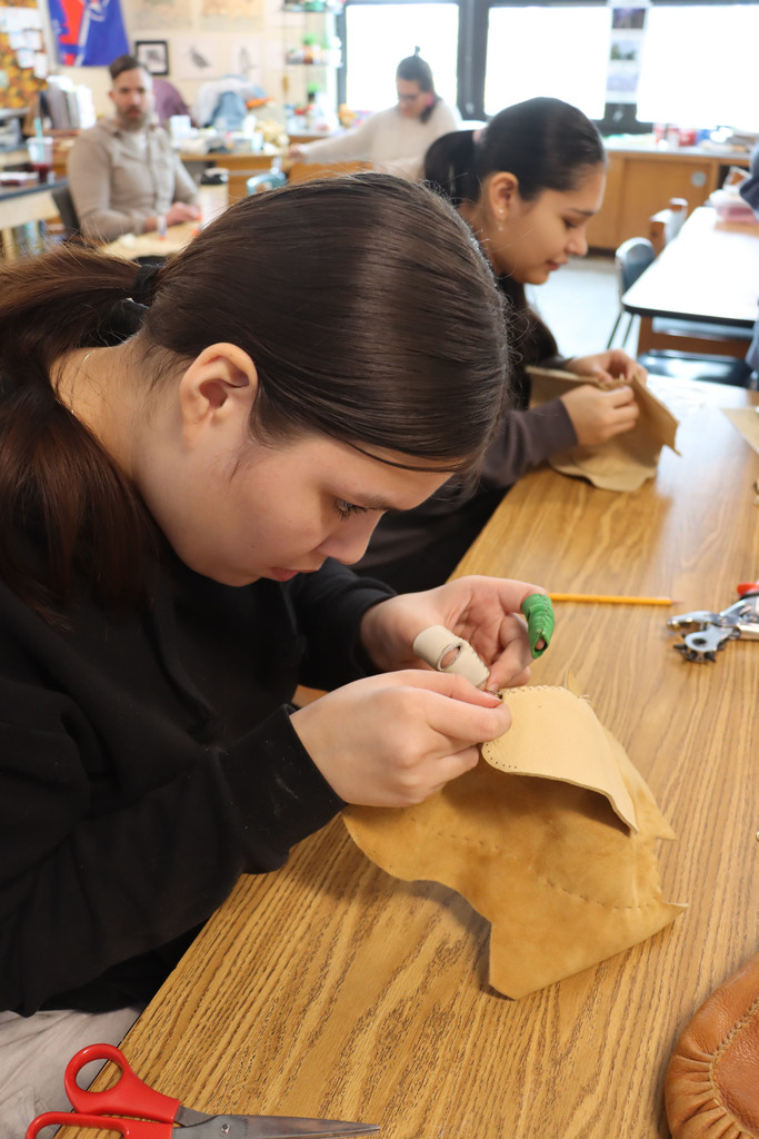 Skyla and Amirya sew. 