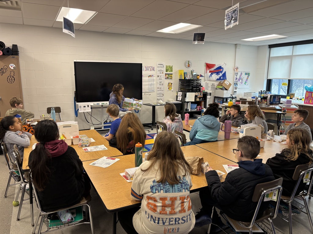Auggie reads to Mrs. Vasko's class.