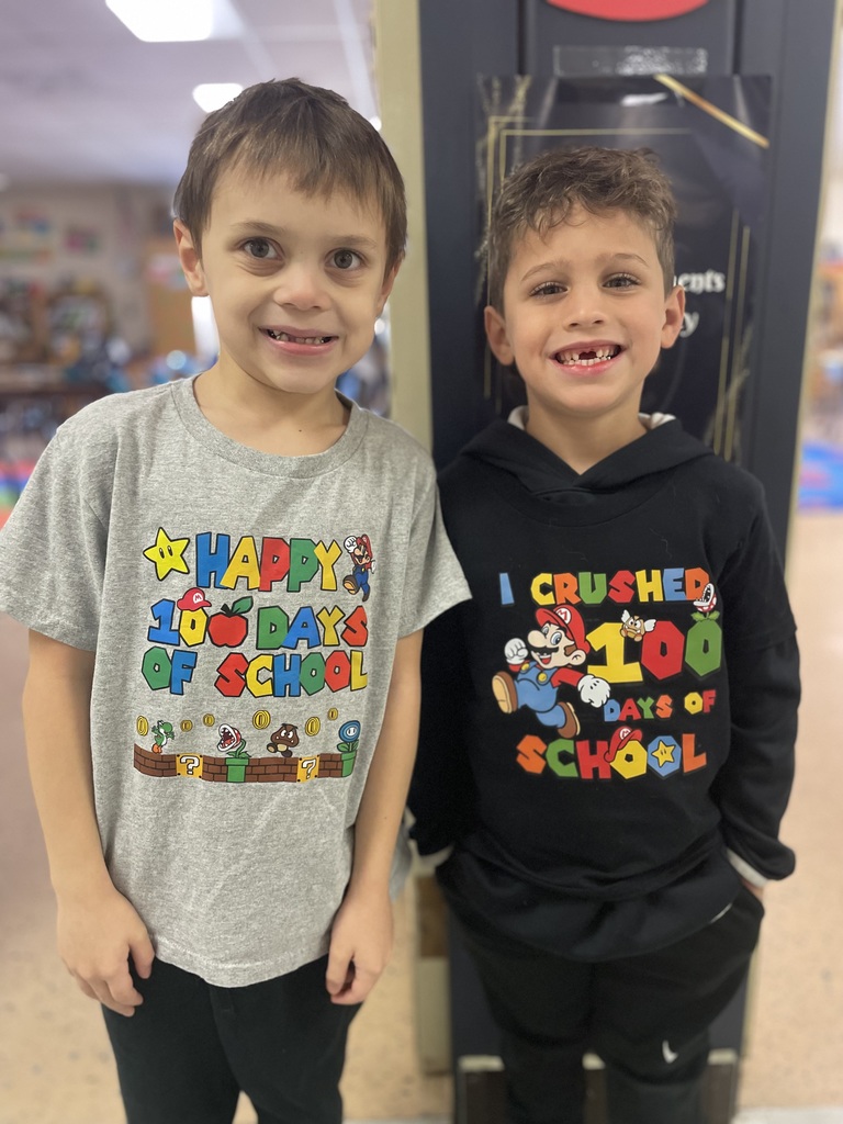 two students wear 100 day shirts