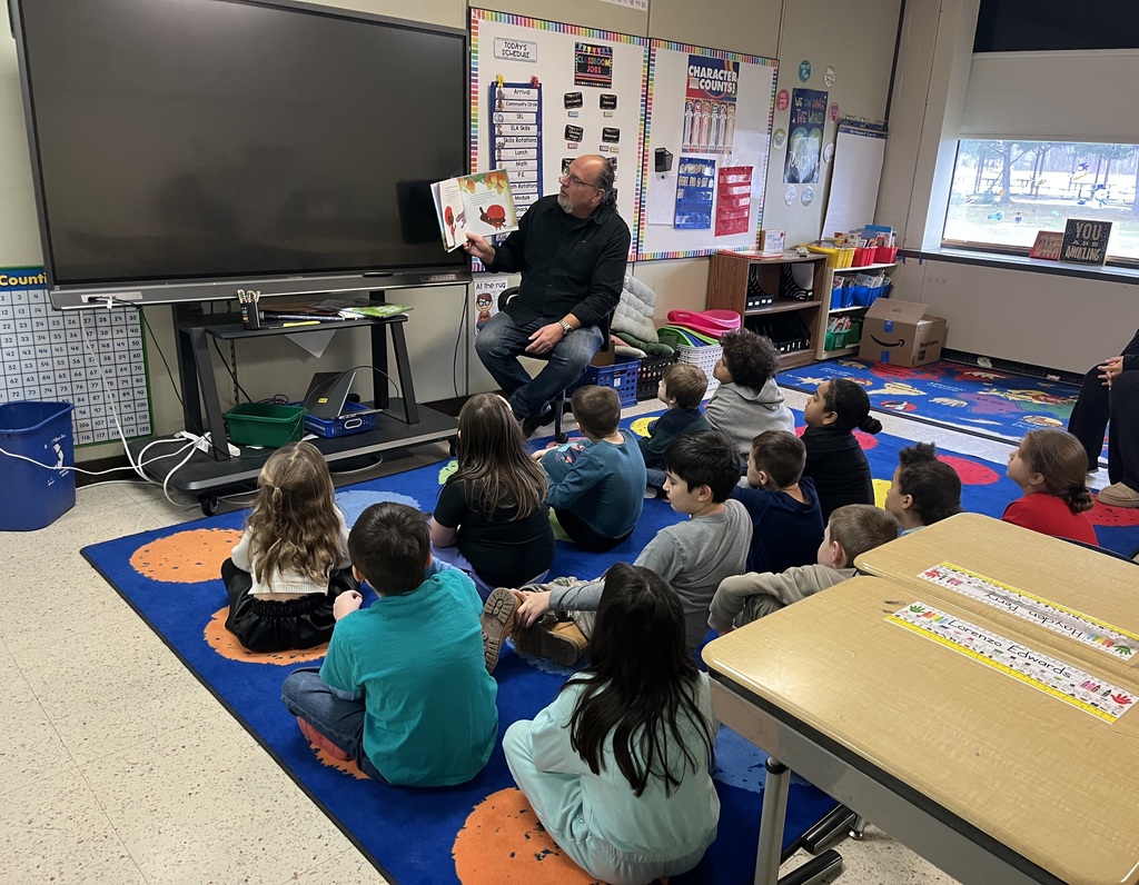 Mr. Bogosian reads to the class. 