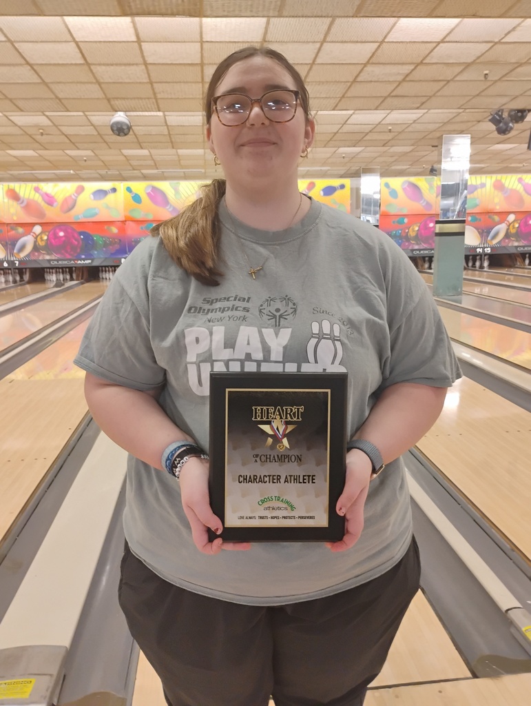 Belle Shumaker holding her award