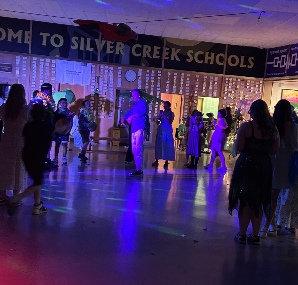 Mr. Prevet dancing in blacklights at MS dance
