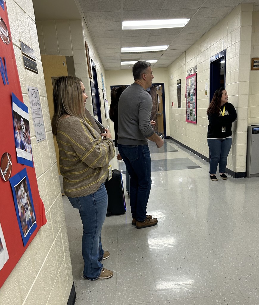 Mr. Prevet smiling in hallway