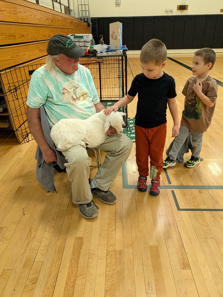 line of children petting lamb in Mr. Morton's lap