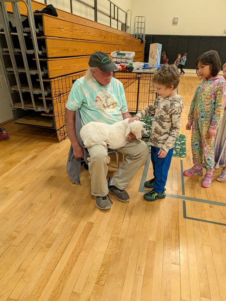 line of children petting lamb in Mr. Morton's lap